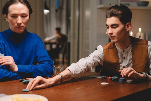 Poker players strategizing at a table
